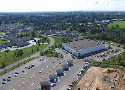 First flex building, including New Cov Manufacturing and Vuzix (Lot Q), and the site of the flex building (Lot R), left to right; background — DDS Companies (Lot Y).